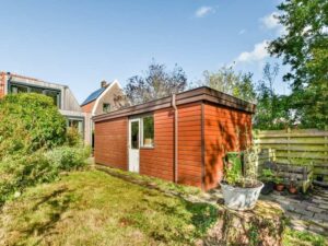 Backyard storage shed placed on a residential property where a lot survey helps determine the best location.