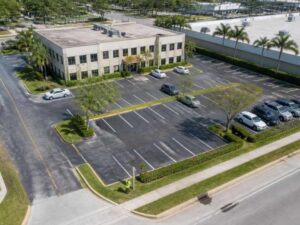 ALTA land survey review of an older office building with parking and access areas in West Palm Beach, Florida