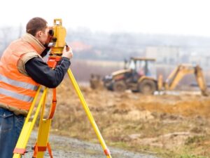 Boundary survey of a large residential parcel showing property corners, boundary markers, and site conditions
